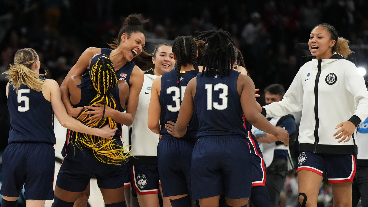 UConn players hug after beating Stanford