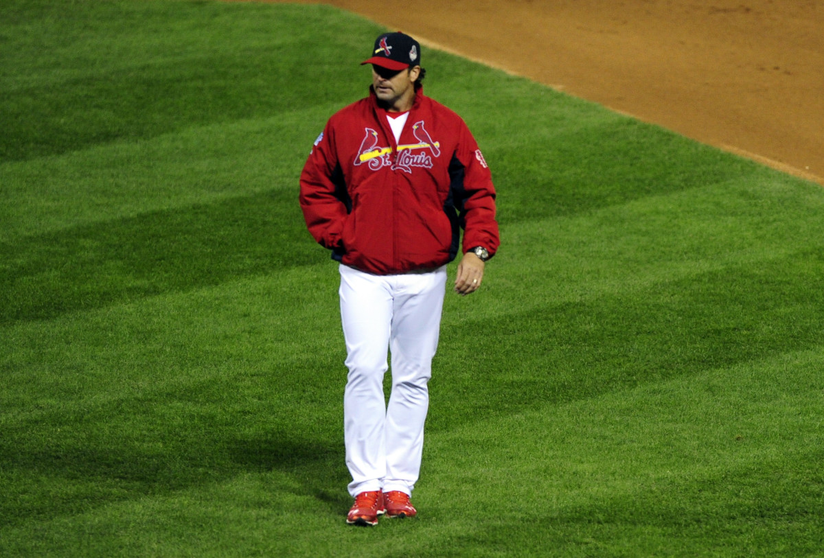 Oct 27, 2013; St. Louis, MO, USA; St. Louis Cardinals manager Mike Matheny (22) returns to the dugout after arguing a call during the fourth inning of game four of the MLB baseball World Series against the Boston Red Sox at Busch Stadium. Mandatory Credit: Jeff Curry-USA TODAY Sports