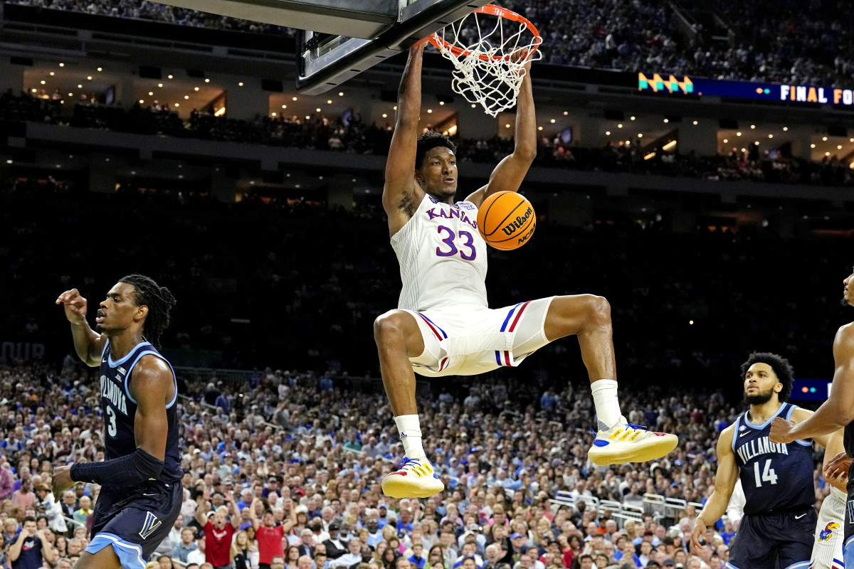 Apr 2, 2022; New Orleans, LA, USA; Kansas Jayhawks forward David McCormack (33) dunks the ball against dunks the ball against Villanova Wildcats forward Brandon Slater (3) during the second half in the 2022 NCAA men's basketball tournament Final Four semifinals at Caesars Superdome. Mandatory Credit: Robert Deutsch-USA TODAY Sports