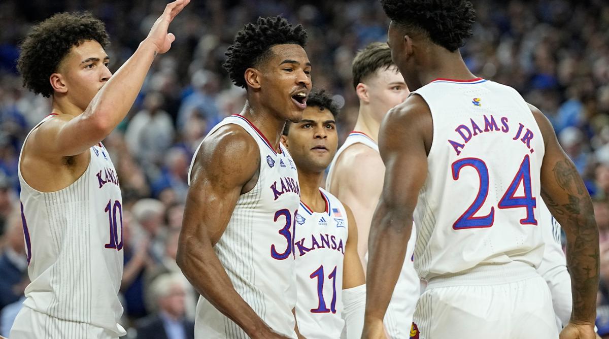 Kansas’ Ochai Agbaji (30) celebrates with Jalen Wilson (10), Remy Martin (11) and K.J. Adams (24) after their win against Villanova in a college basketball game in the semifinal round of the Men’s Final Four NCAA tournament, Saturday, April 2, 2022, in New Orleans.