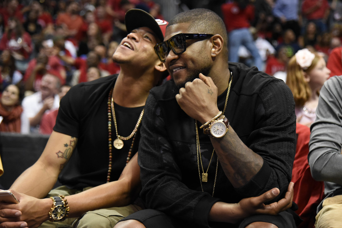 May 20, 2015; Atlanta, GA, USA; Recording artist Usher (right) attends game one of the Eastern Conference Finals of the NBA Playoffs between the Atlanta Hawks and the Cleveland Cavaliers at Philips Arena.