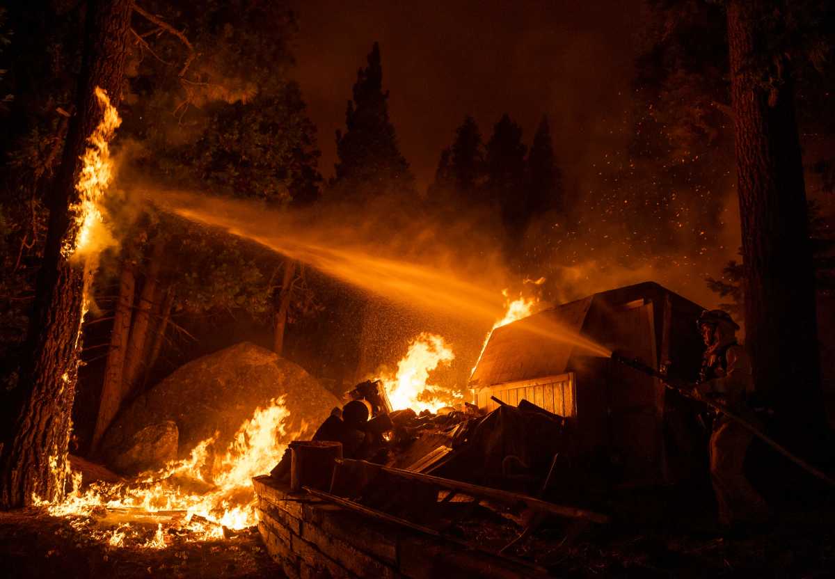 El Dorado County firefighters battle a fire close to a home off of U.S. Highway 89 in the Christmas Valley community near Meyers, Calif., on Monday, Aug. 30, 2021. News Caldor Fire