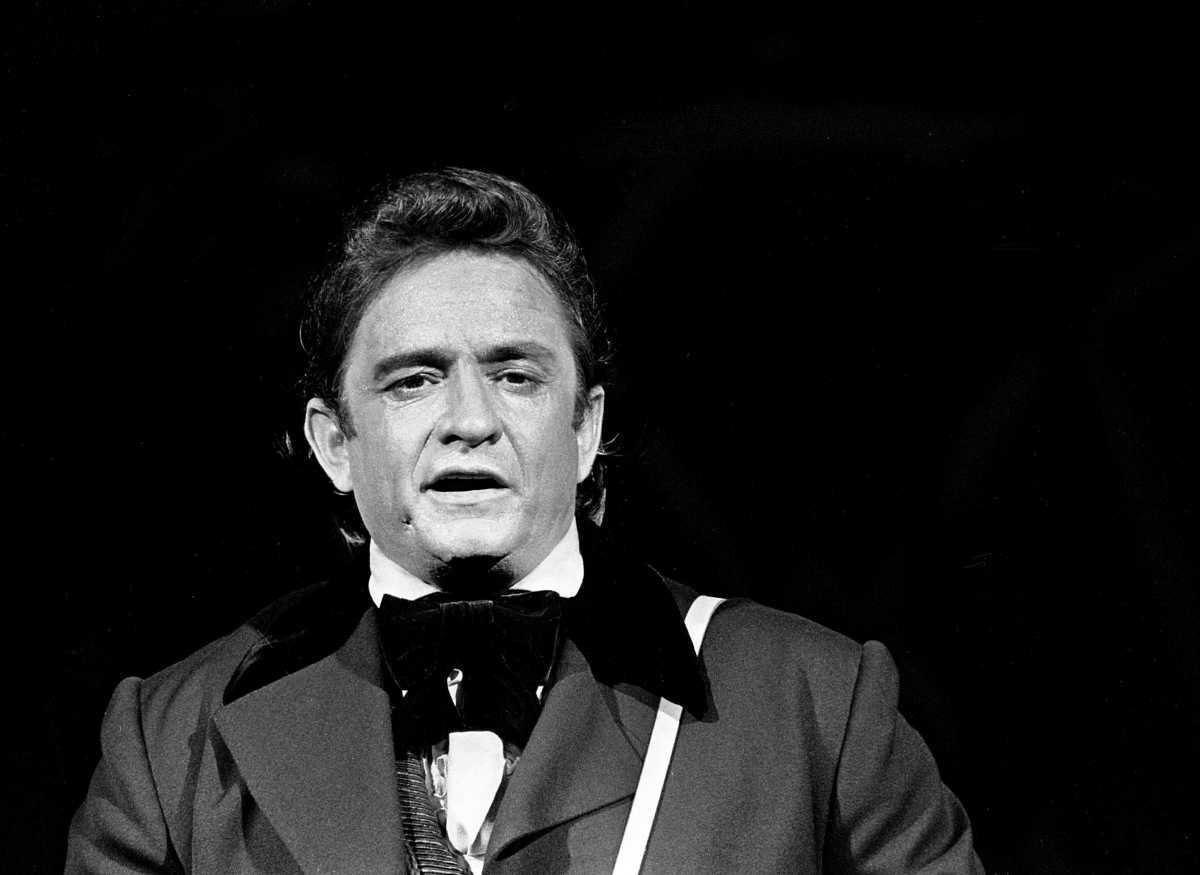 Host and star Johnny Cash is introducing guest Neil Diamond during a taping for the season premiere of \"The Johnny Cash Show\" at the Ryman Auditorium Sept. 17, 1970. 70then09 096c