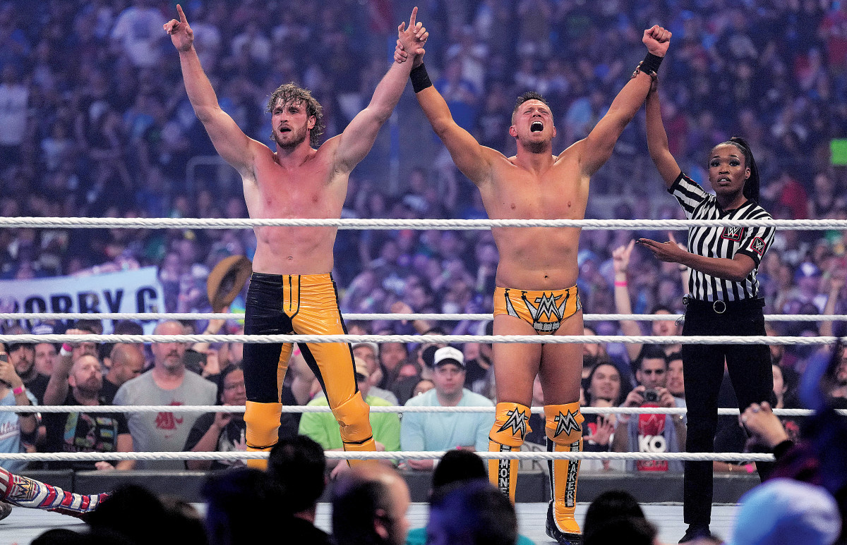 The Miz and Logan Paul celebrate their victory after Miz was able to hit Rey Mysterio with a Skull-Crushing Finale to get the pin at Wrestlemania 38 in AT&T Stadium in Arlington, Texas.