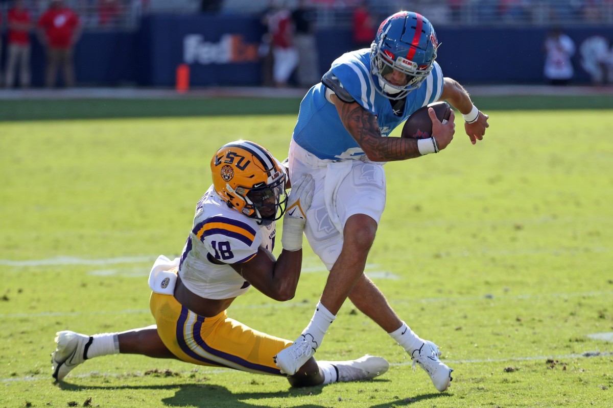 Oct 23, 2021; Oxford, Mississippi, USA; Mississippi Rebels quarterback Matt Corral (2) is sacked for a loss by LSU Tigers linebacker Damone Clark (18) during the first half at Vaught-Hemingway Stadium.