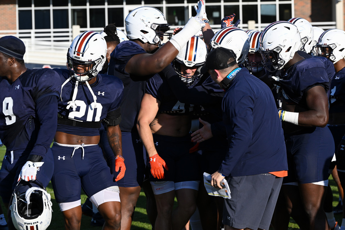 Johnathan LeGrand celebrates with the defense after winning a challenge making the offense do extra conditioning.Auburn FB practice on Monday. April 4, 2022 in Auburn, Ala.