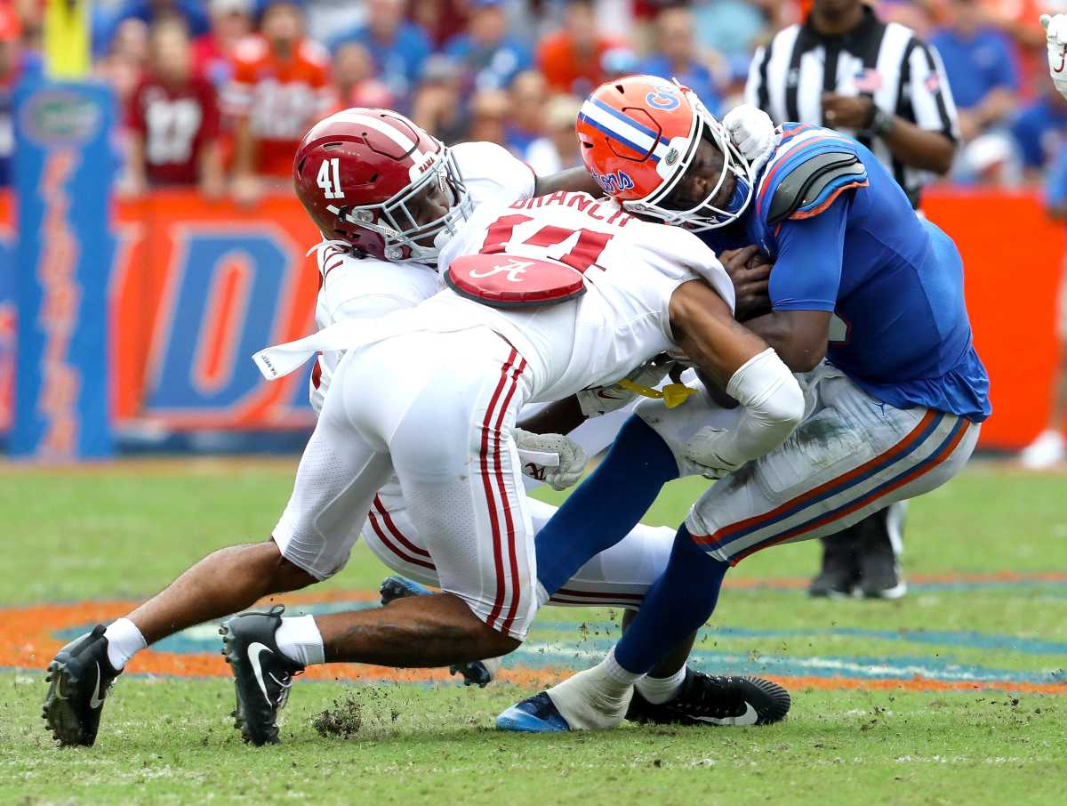 Florida Gators quarterback Emory Jones (5) is hit hard by Alabama Crimson Tide defensive back Brian Branch (14) during the football game between the Florida Gators and The Alabama Crimson Tide, at Ben Hill Griffin Stadium in Gainesville, Fla. Sept. 18, 2021.