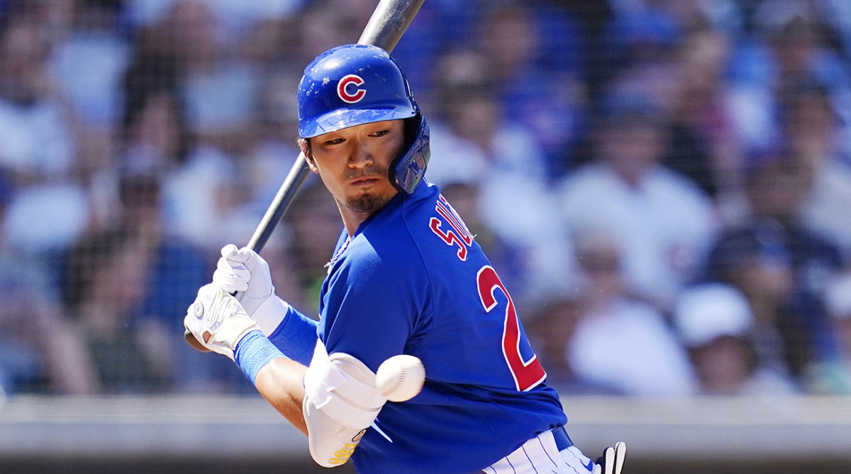 Chicago Cubs' Seiya Suzuki, of Japan, turns away from an inside pitch during the second inning of a spring training baseball game against the Chicago White Sox.