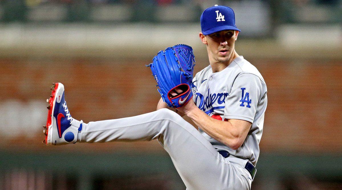 Dodgers starting pitcher Walker Buehler (21) pitches during the first inning at bat in game six of the 2021 NLCS at Truist Park.