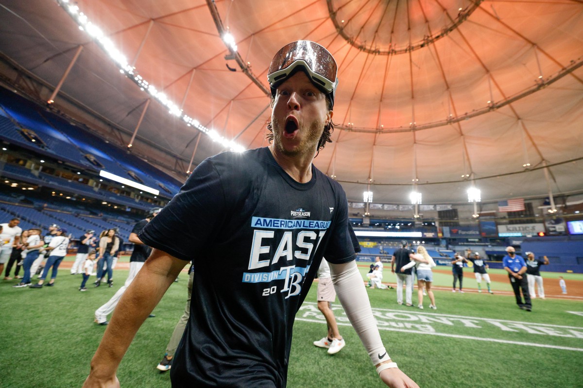 Sep 25, 2021; St. Petersburg, Florida, USA; Tampa Bay Rays right fielder Brett Phillips (35) celebrates after winning the american league east title at Tropicana Field. Mandatory Credit: Nathan Ray Seebeck-USA TODAY Sports