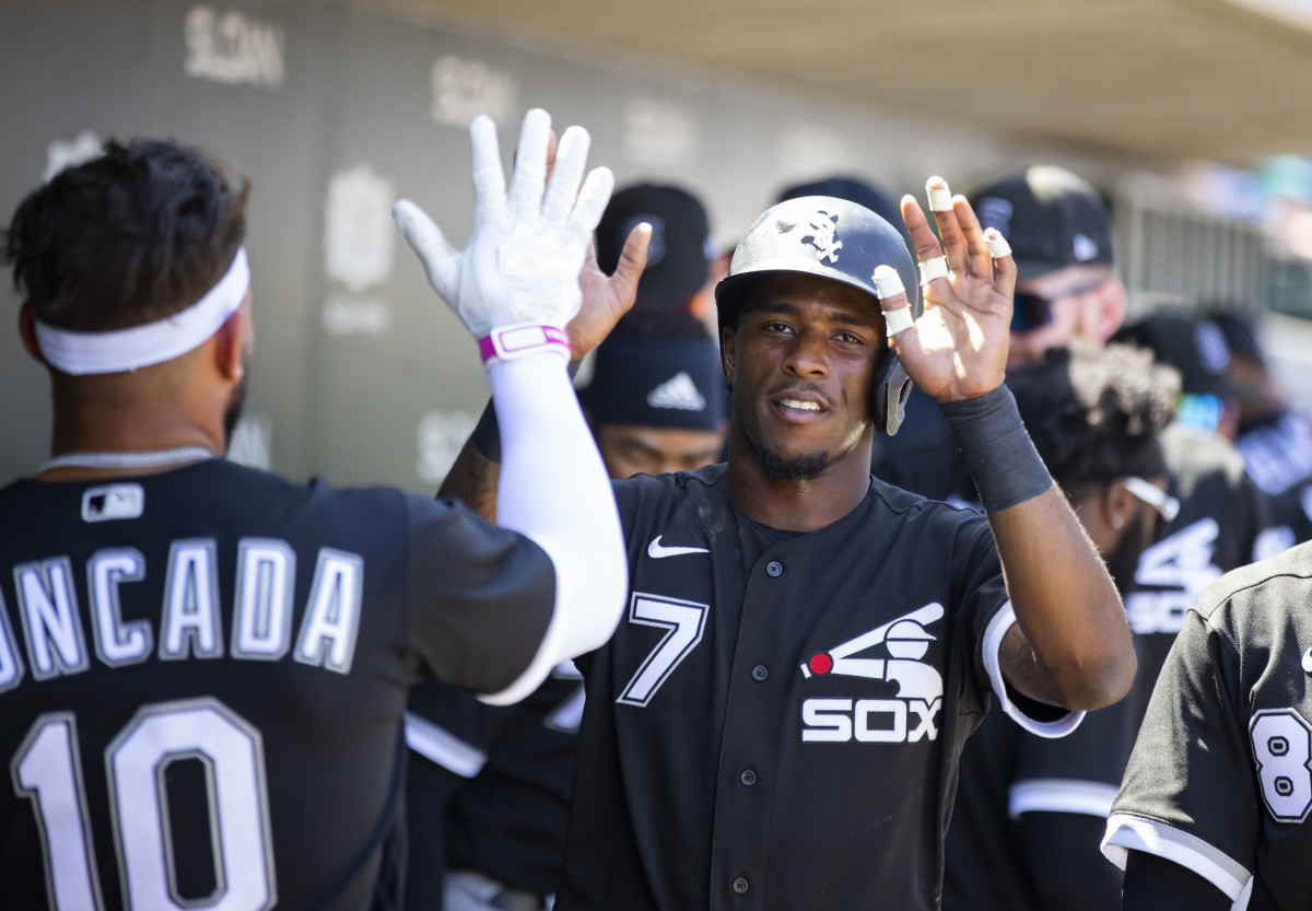 Apr 4, 2022; Mesa, Arizona, USA; Chicago White Sox infielder Tim Anderson (7) celebrates with teammates after scoring against the Chicago Cubs during spring training at Sloan Park. Mandatory Credit: Mark J. Rebilas-USA TODAY Sports