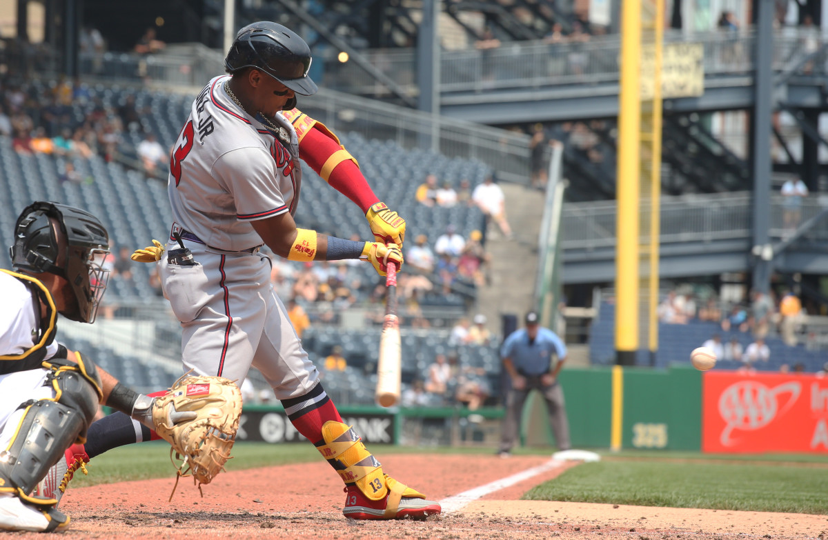 Jul 7, 2021; Pittsburgh, Pennsylvania, USA; Atlanta Braves right fielder Ronald Acuna Jr. (13) singles against the Pittsburgh Pirates during the sixth inning at PNC Park. Mandatory Credit: Charles LeClaire-USA TODAY Sports