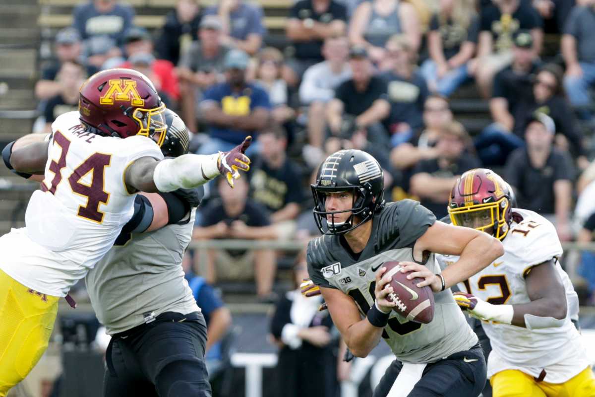 Minnesota defensive linebacker Boye Mafe (34) dives for Purdue quarterback Jack Plummer (13) as he looks for a solution during the fourth quarter of a NCAA football game, Saturday, Sept. 28, 2019 at Ross-Ade Stadium in West Lafayette. Minnesota won, 38-31. Cfb Purdue Vs Minnesota
