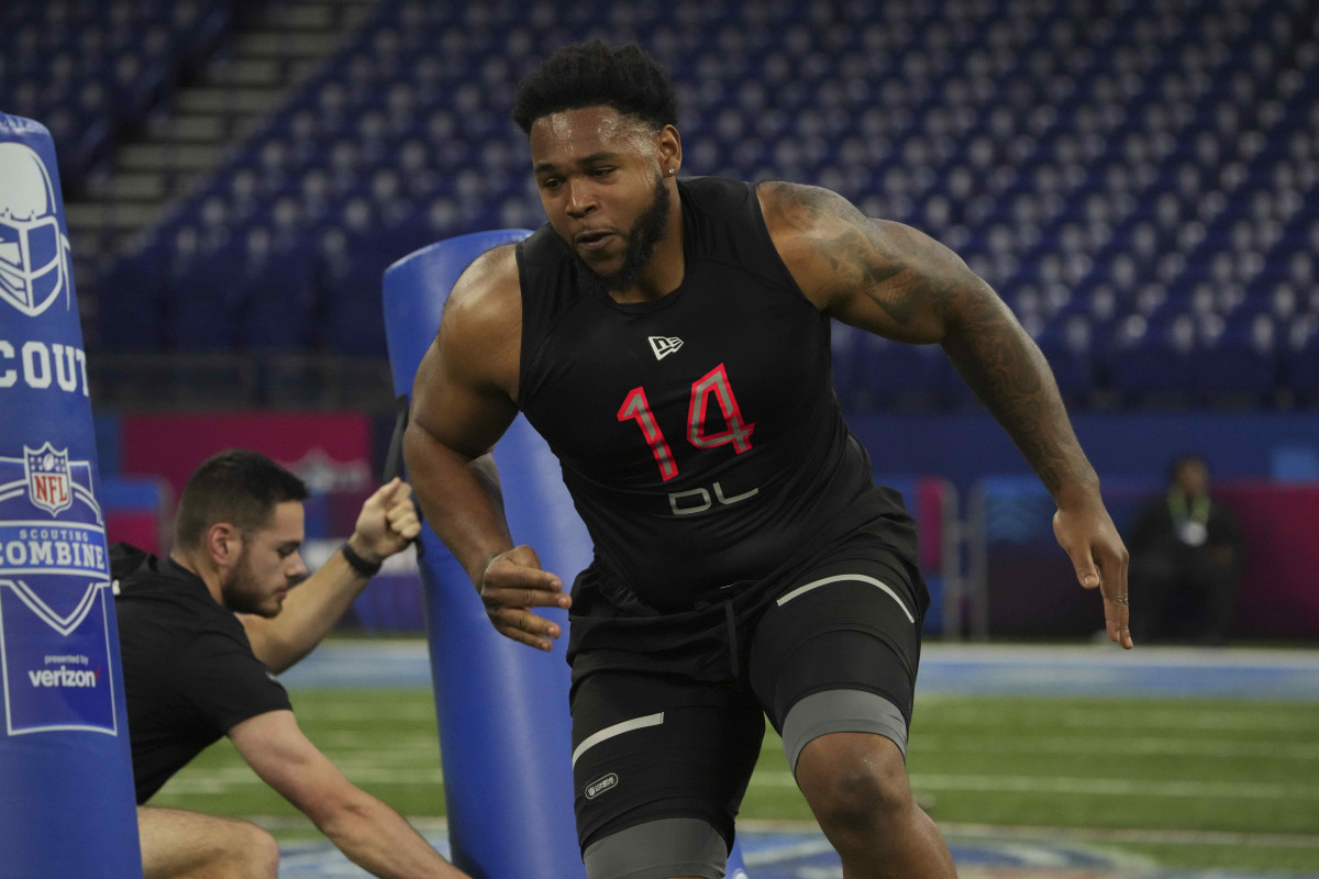Mar 5, 2022; Indianapolis, IN, USA; Connecticut defensive lineman Travis Jones (DL14) goes through drills during the 2022 NFL Scouting Combine at Lucas Oil Stadium. Mandatory Credit: Kirby Lee-USA TODAY Sports