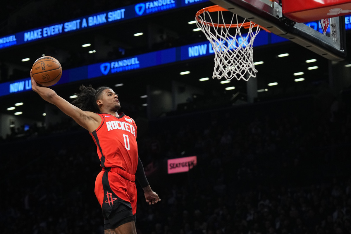 Apr 5, 2022; Brooklyn, New York, USA; Houston Rockets shooting guard Jalen Green (0) dunks the ball against the Brooklyn Nets during the first half of the game at Barclays Center. Mandatory Credit: Gregory Fisher-USA TODAY Sports