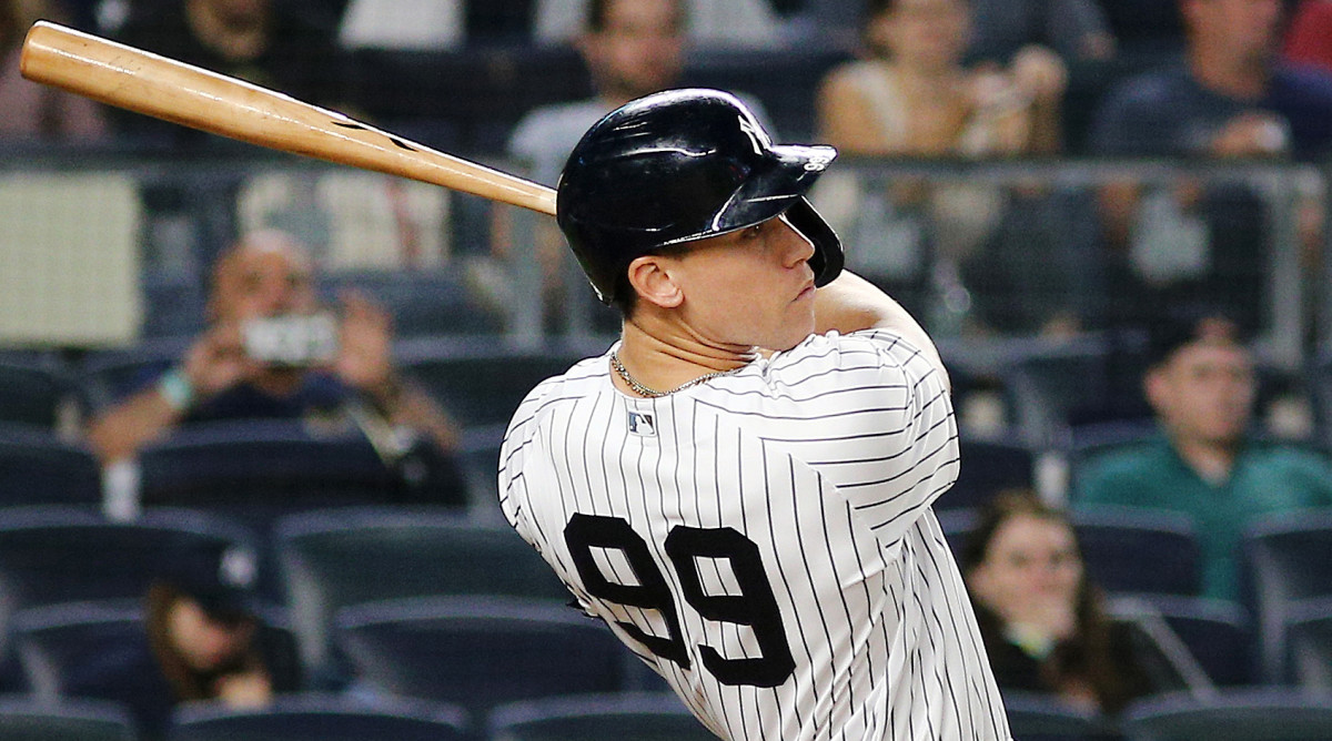 Sep 17, 2021; Bronx, New York, USA; New York Yankees right fielder Aaron Judge (99) hits a solo home run against the Cleveland Indians during the fourth inning at Yankee Stadium.