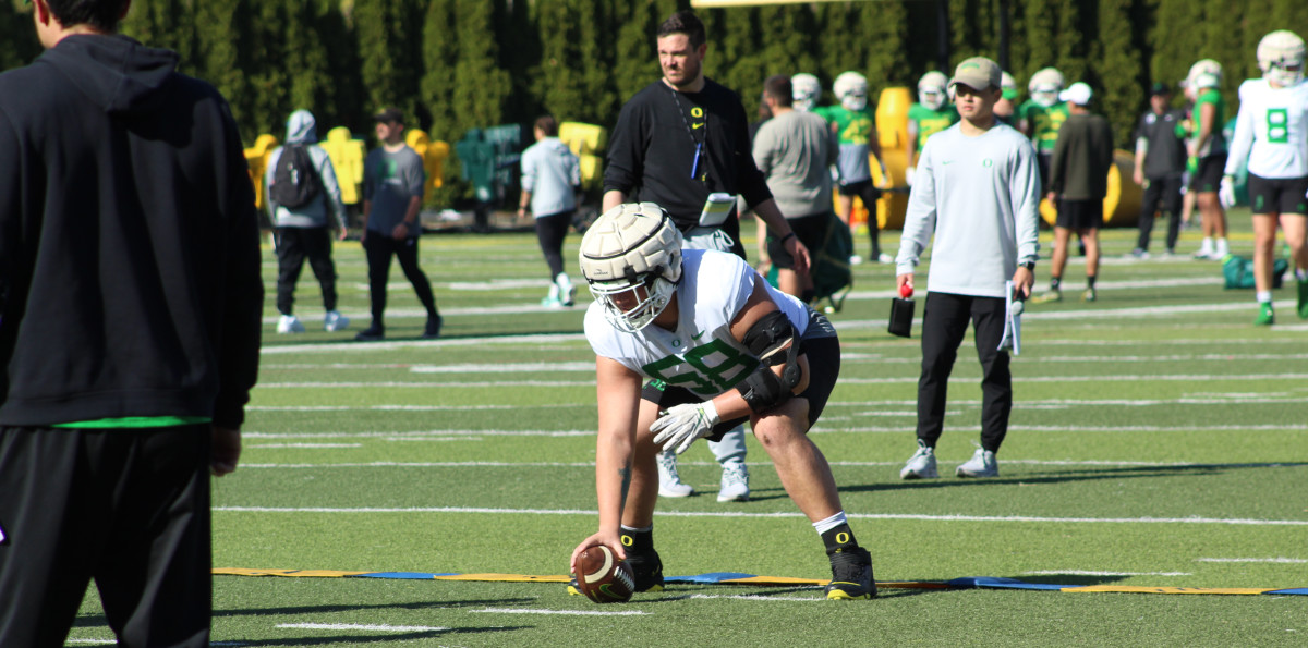 Oregon lineman Jackson Powers-Johnson practices snapping during spring ball.