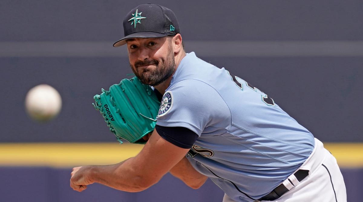 Seattle Mariners starting pitcher Robbie Ray throws during the first inning of a spring training baseball game against the Texas Rangers Monday, March 28, 2022, in Peoria, Ariz.