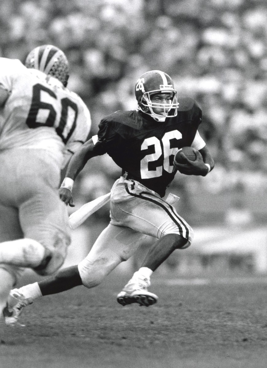 Alabama Crimson Tide running back Bobby Humphrey (26) carries the ball against the Michigan Wolverines during the 1987 Hall of Fame Bowl at Tampa Stadium. Michigan won the game 28-24.