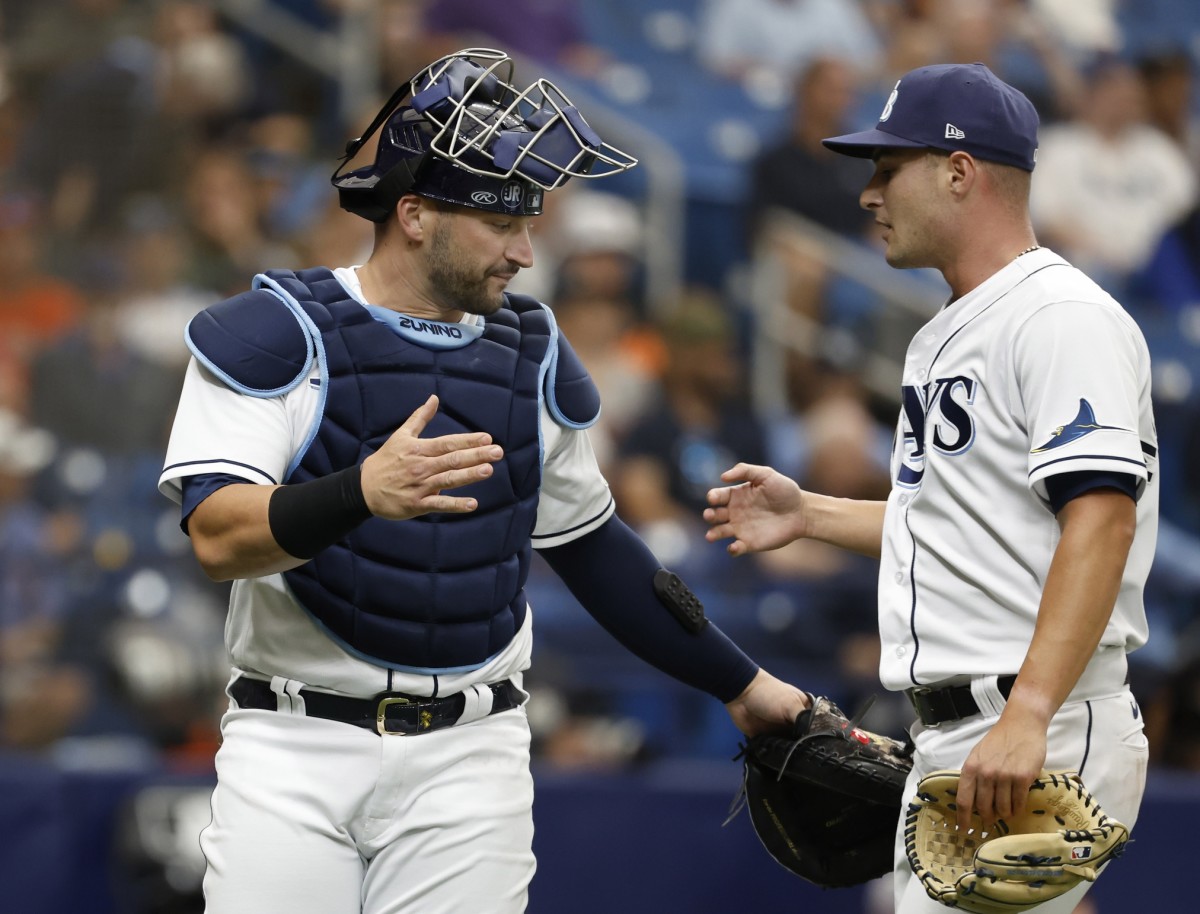 Tampa Bay Rays catcher Mike Zunino congratulations pitcher Shane McClanahan after getting out of trouble in the second inning. (Kim Klement/USA TODAY Sports)