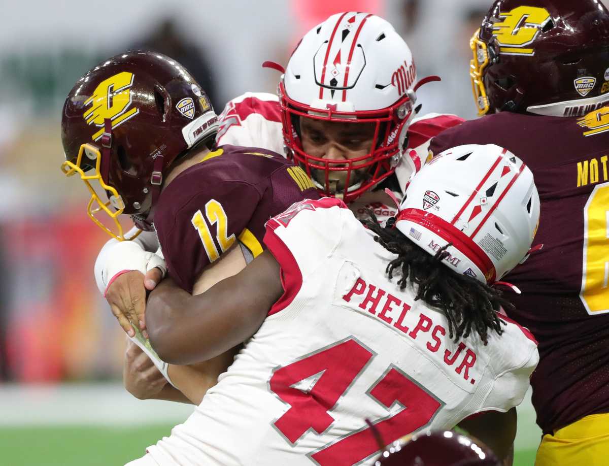 Miami (Ohio) RedHawks defensive lineman Lonnie Phelps sacks Central Michigan Chippewas quarterback Quinten Dormady during the first half of the MAC championship game Saturday, Dec. 7, 2019 at Ford Field in Detroit. Mac