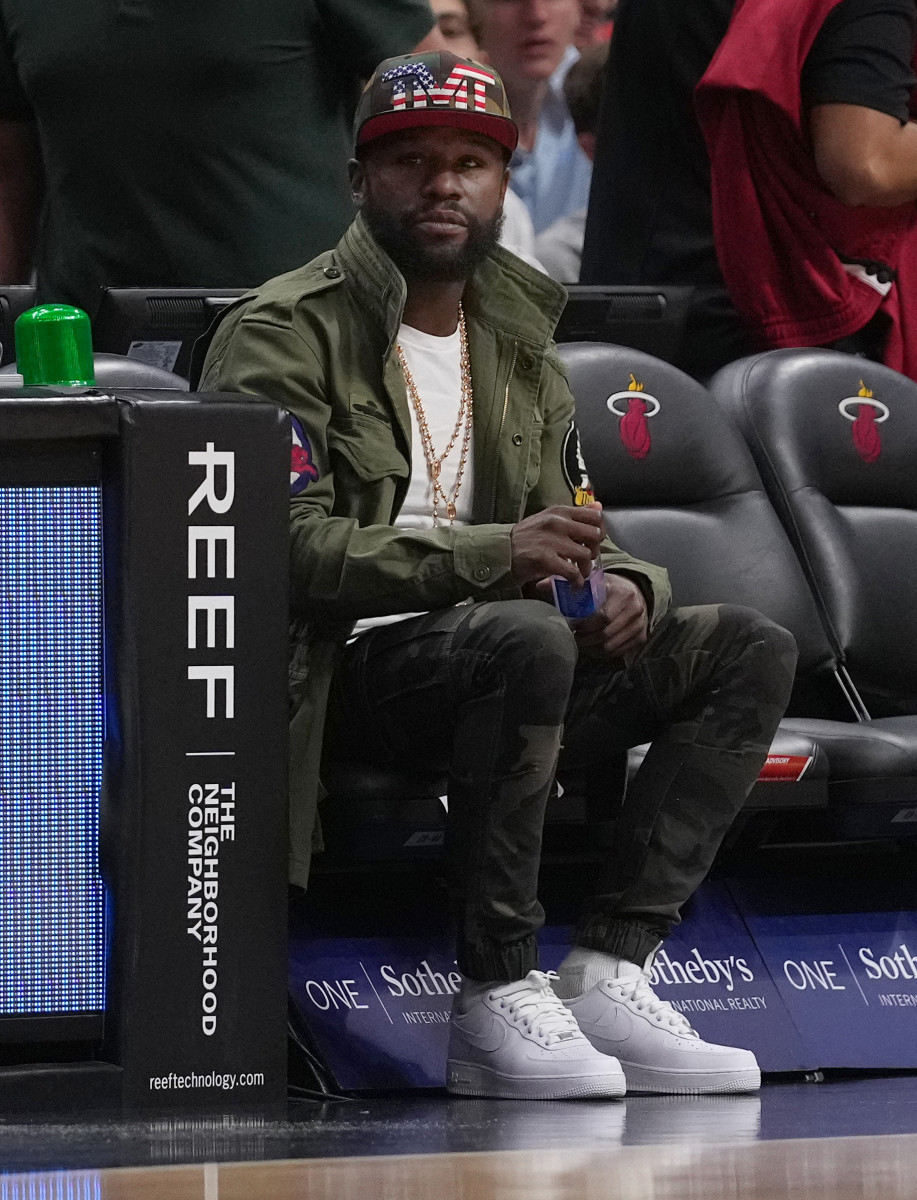 Apr 8, 2022; Miami, Florida, USA; Professional boxer Floyd Mayweather Jr. sits court side during the first half between the Miami Heat and the Atlanta Hawks at FTX Arena.
