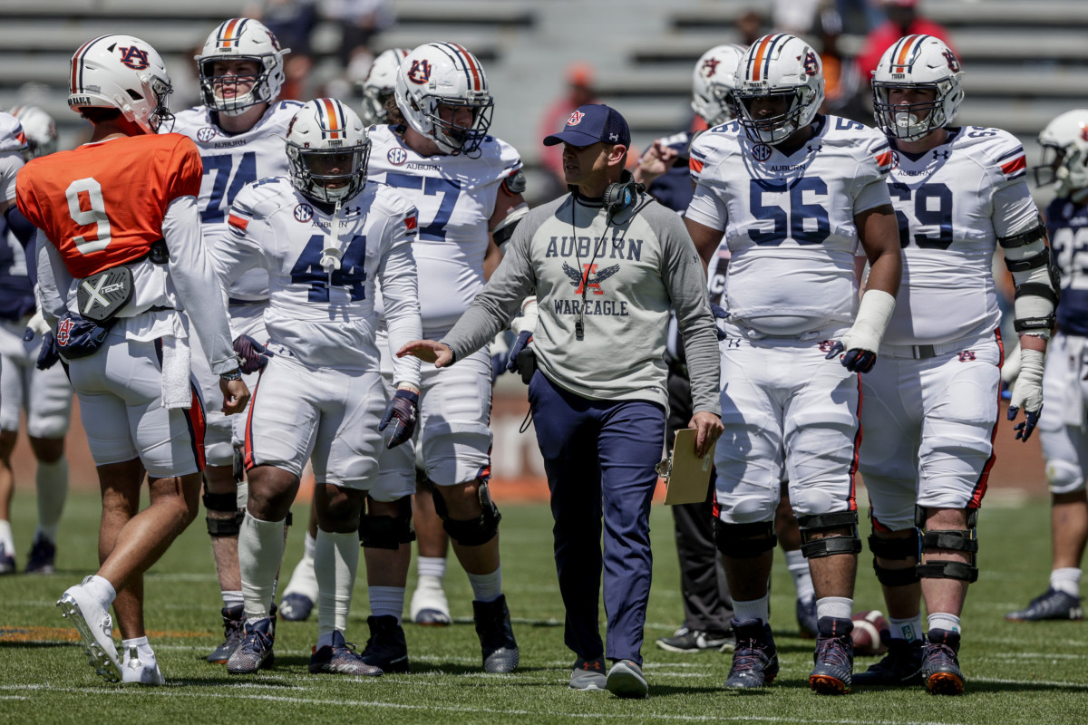 Auburn head coach Bryan Harsin talks with players during the A-Day NCAA college spring football game at Jordan-Hare Stadium, Saturday, April 9, 2022, in Auburn, Ala. (AP Photo/Butch Dill)