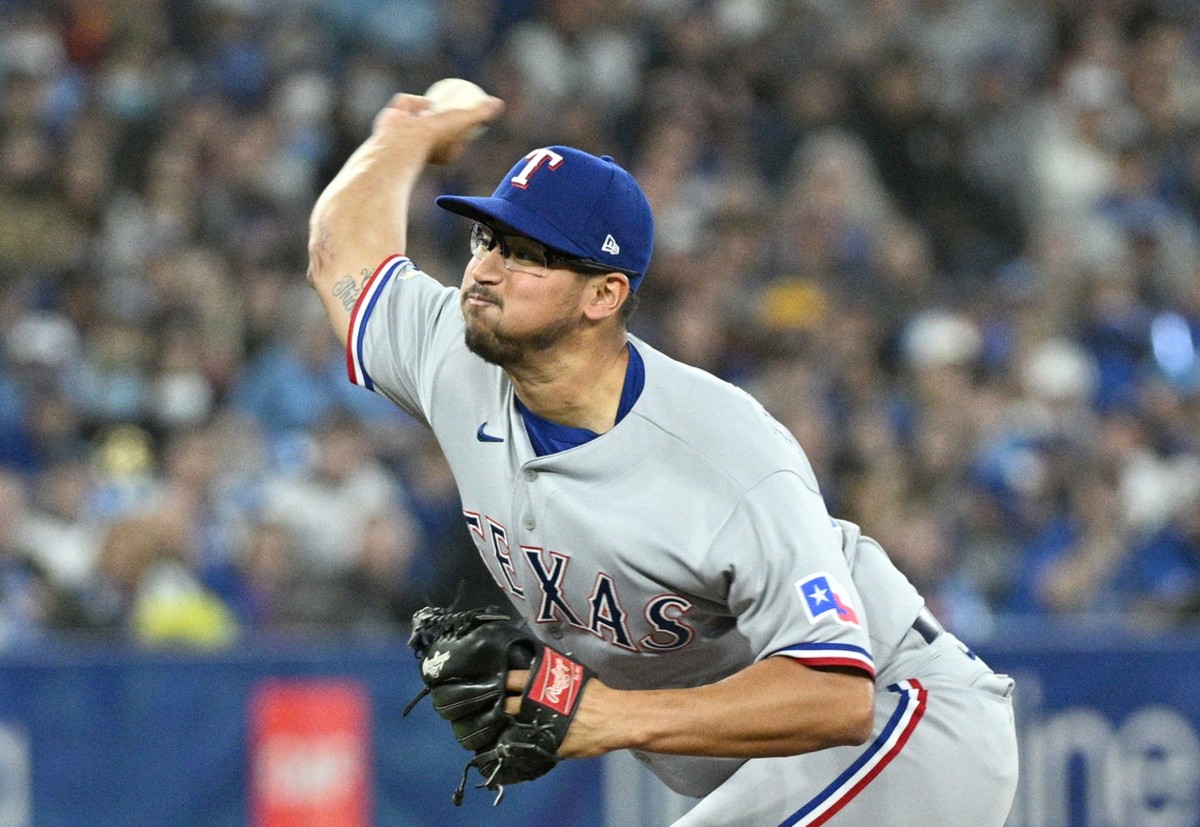 Apr 9, 2022; Toronto, Ontario, CAN; Texas Rangers starting pitcher dane Dunning (33) delivers a pitch against the Toronto Blue Jays in the first inning at Rogers Centre. Mandatory Credit: Dan Hamilton-USA TODAY Sports