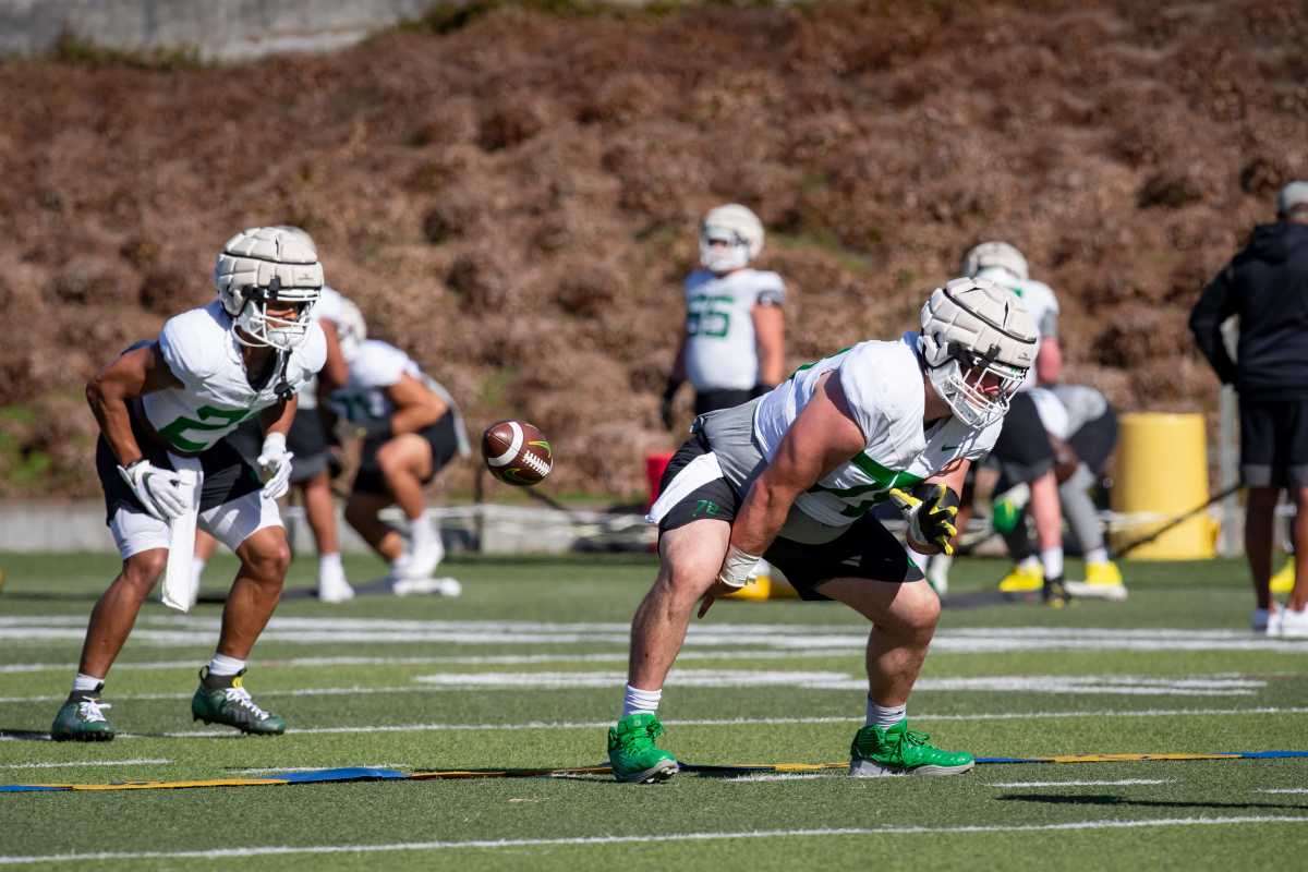 Oregon center Alex Forsyth practices snapping during spring ball.