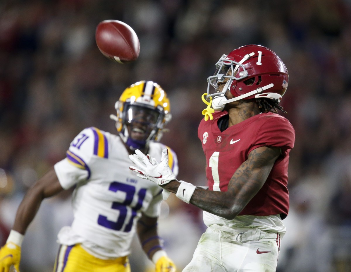 Alabama receiver Jameson Williams (1) catches a long pass for a touchdown against LSU defensive back Cameron Lewis (31). Mandatory Credit: Gary Cosby Jr.-USA TODAY