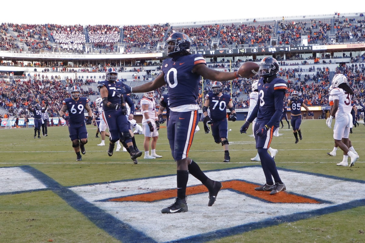 Nov 27, 2021; Charlottesville, Virginia, USA; Virginia Cavaliers tight end Jelani Woods (0) celebrates after scoring a touchdown against the Virginia Tech Hokies during the first quarter at Scott Stadium.