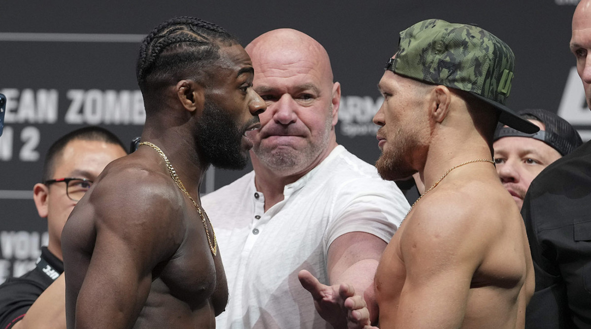 Aijamain Sterling faces off with Petr Yan during weigh ins for UFC 273.