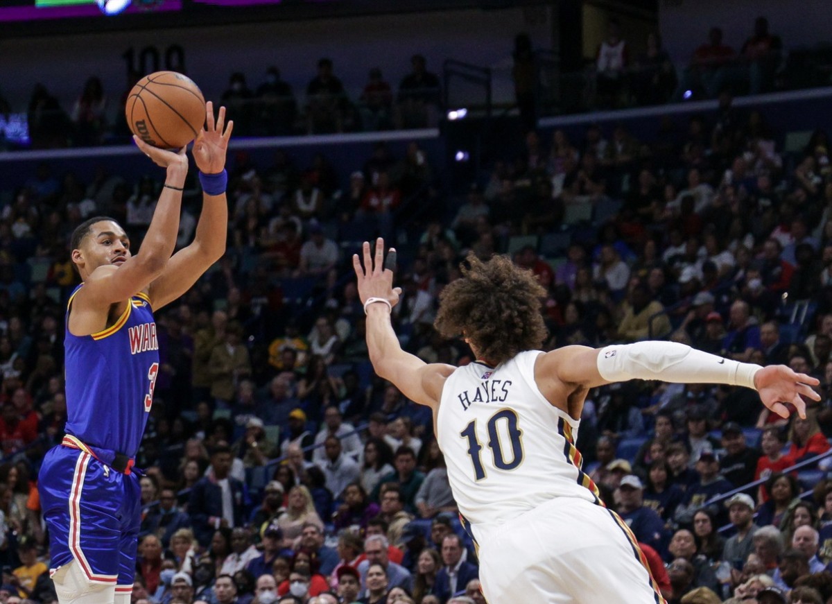 Apr 10, 2022; New Orleans, Louisiana, USA; Golden State Warriors guard Jordan Poole (3) shoots a jump shot against New Orleans Pelicans center Jaxson Hayes (10) during the first half at the Smoothie King Center. Mandatory Credit: Stephen Lew-USA TODAY Sports