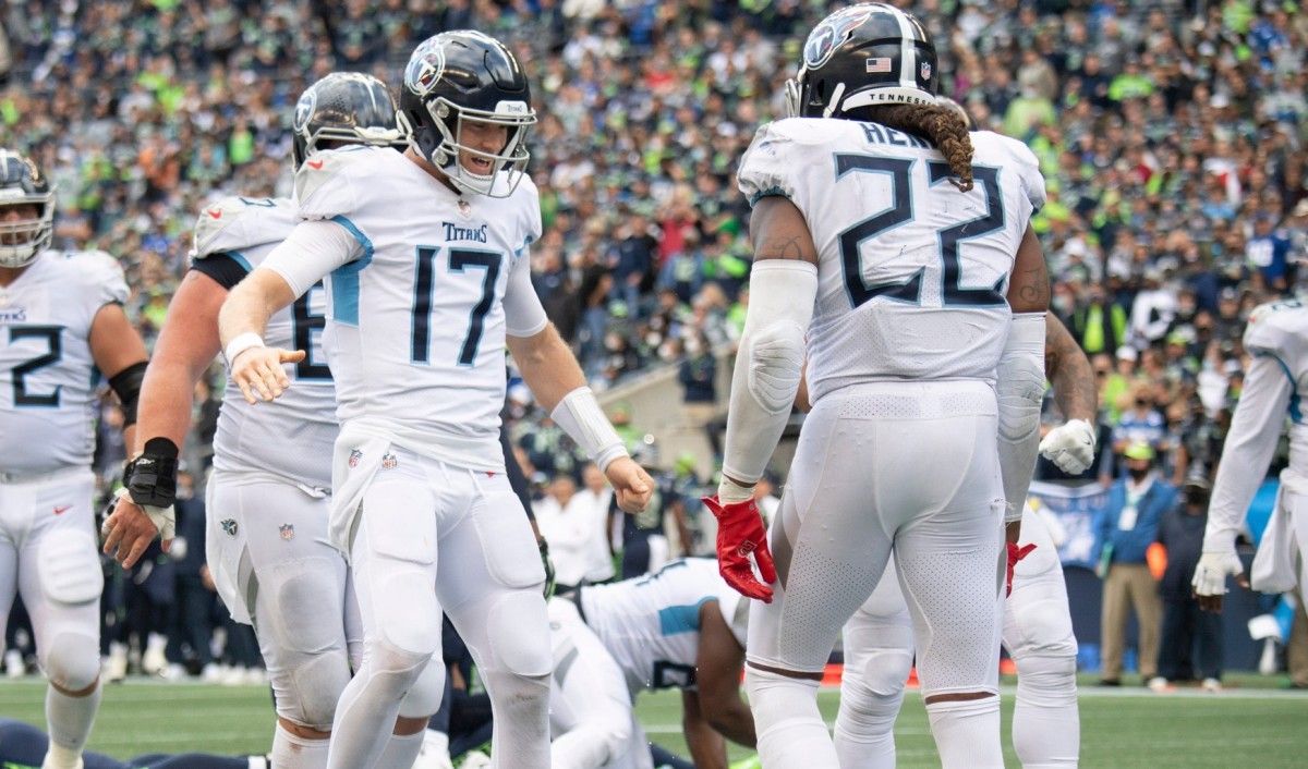 Tennessee Titans quarterback Ryan Tannehill (17) congratulates running back Derrick Henry (22) after his touchdown against the Seattle Seahawks to tie the game during the second half at Lumen Field Sunday, Sept. 19, 2021 in Seattle, Wash.