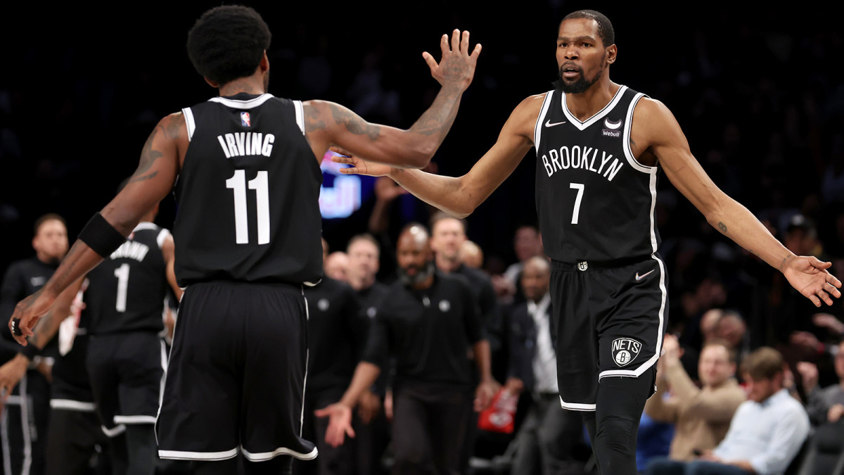 Brooklyn Nets forward Kevin Durant (7) high fives guard Kyrie Irving (11) during the third quarter against the Detroit Pistons.