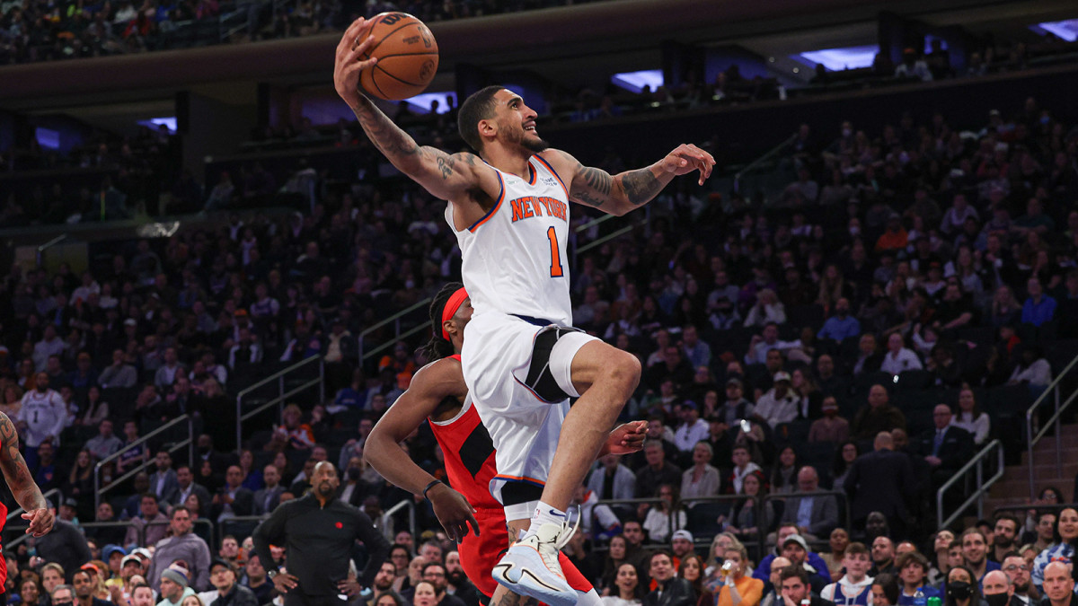 New York Knicks forward Obi Toppin (1) dunks the ball against the Toronto Raptors.