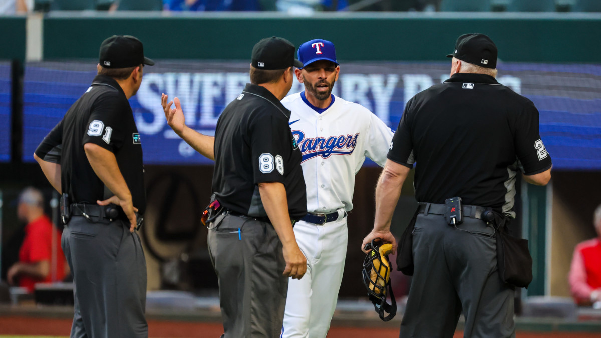 Apr 11, 2022; Arlington, Texas, USA; Texas Rangers manager Chris Woodward (8) argues with the umpires after the game against the Colorado Rockies at Globe Life Field. Mandatory Credit: Kevin Jairaj-USA TODAY Sports