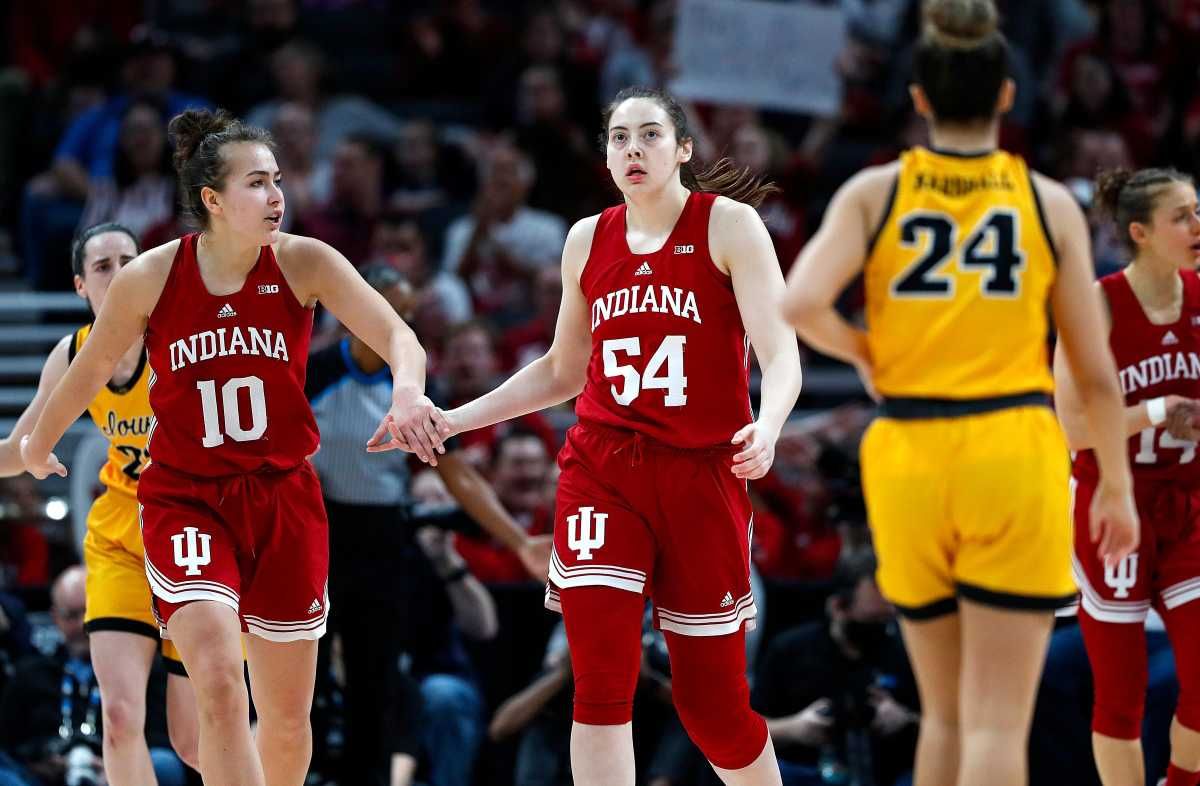 Aleksa Gulbe and Mackenzie Holmes celebrate a call in their favor.