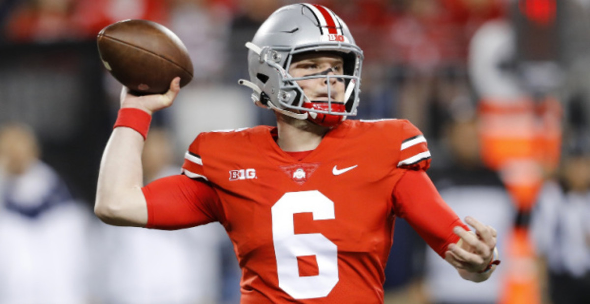 Ohio State Buckeyes quarterback Kyle McCord attempts a pass during a college football game in the Big Ten.