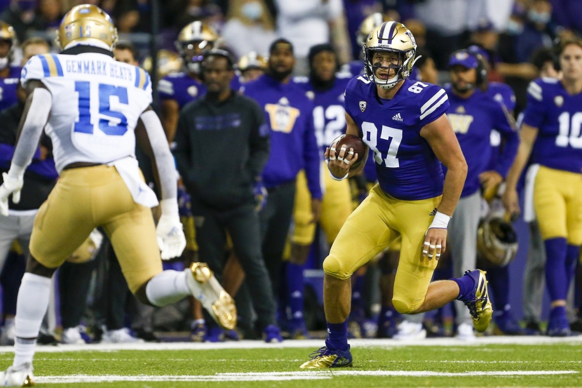 Oct 16, 2021; Seattle, Washington, USA; Washington Huskies tight end Cade Otton (87) runs for yards after the catch against the UCLA Bruins during the second quarter at Alaska Airlines Field at Husky Stadium.