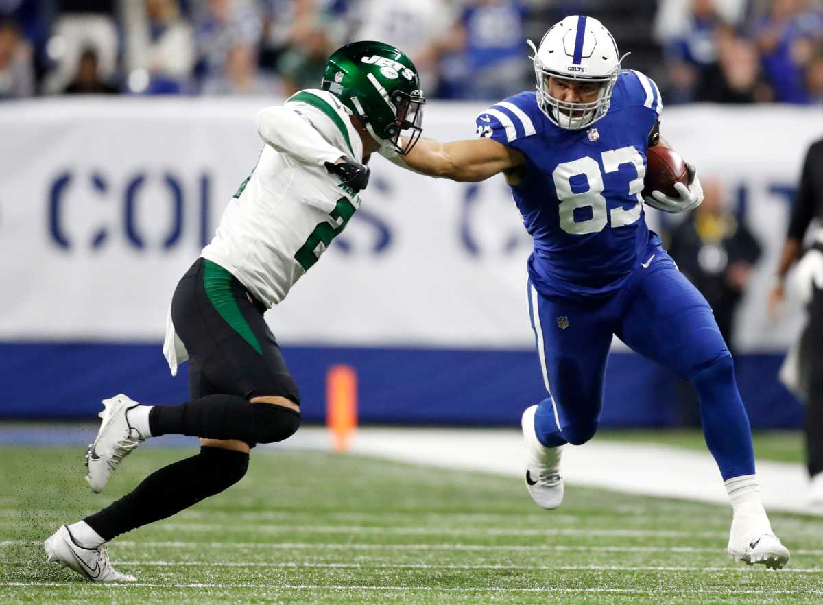 Indianapolis Colts tight end Kylen Granson (83) tries to fight off New York Jets safety Ashtyn Davis (21) as he advances the ball 27 yards Thursday, Nov. 4, 2021, during a game against the New York Jets at Lucas Oil Stadium in Indianapolis.