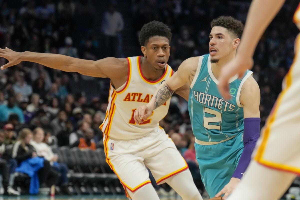 Mar 16, 2022; Charlotte, North Carolina, USA; Charlotte Hornets guard LaMelo Ball (2) drives to the basket against Atlanta Hawks forward De'Andre Hunter (12) during the second half at the Spectrum Center.
