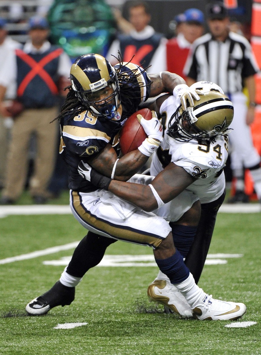 St. Louis Rams running back Steven Jackson (39) is tackled for a loss by New Orleans Saints defensive end Charles Grant (94). Mandatory Credit: Photo by Scott Rovak-USA TODAY 