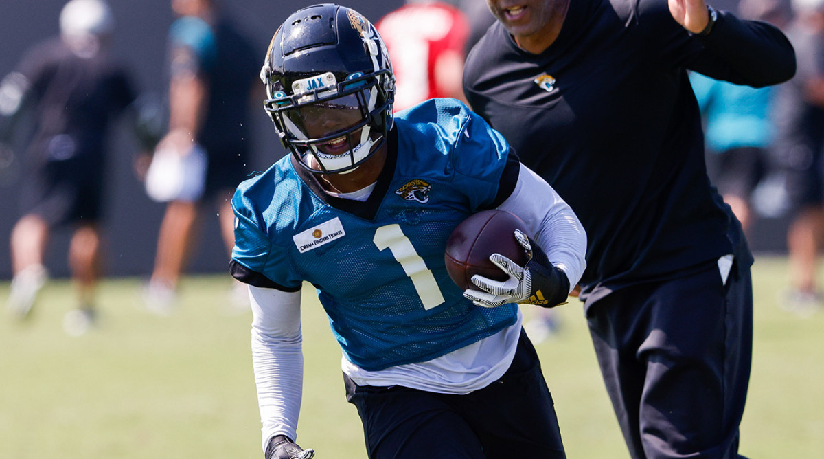 Jacksonville Jaguars running back Travis Etienne (1) participates in training camp at Dream Finders Homes practice field.