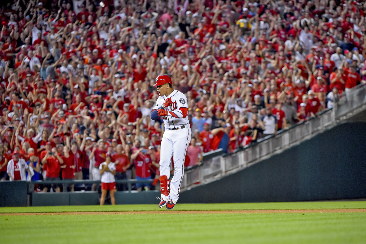 Juan Soto celebrates after hitting a three-run single off Brewers relief ace Josh Hader in the 2019 NL wild-card game.