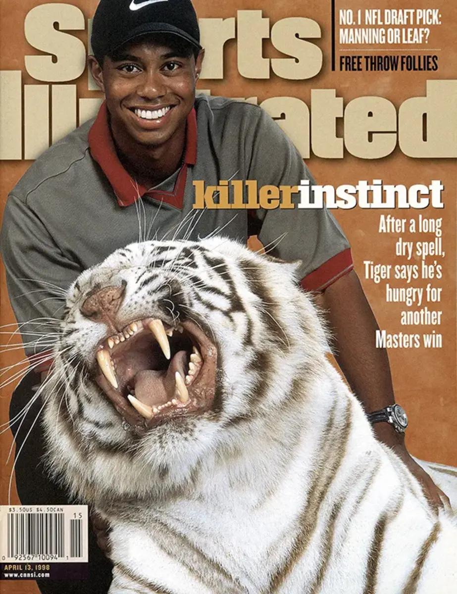 Tiger Woods poses with a real tiger on the cover of Sports Illustrated