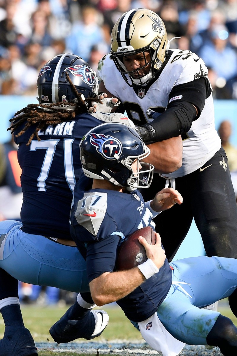 Tennessee Titans quarterback Ryan Tannehill (17) gets sacked by New Orleans Saints defensive end Marcus Davenport (92). George Walker IV / Tennessean.com / USA TODAY NETWORK