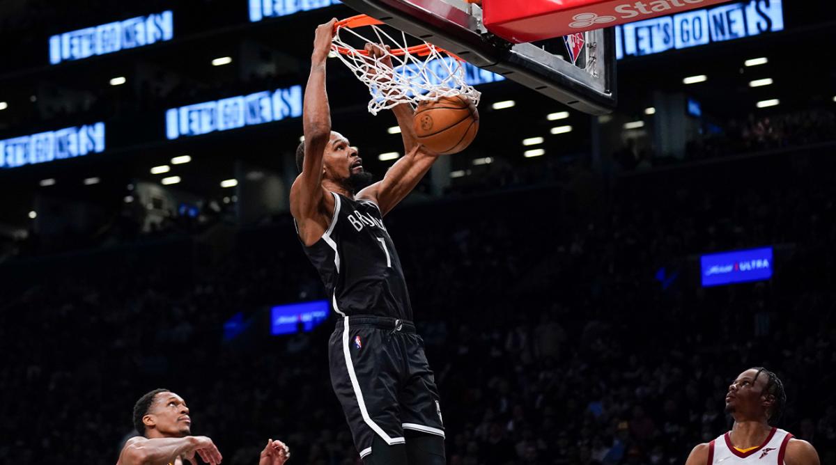 Brooklyn Nets’ Kevin Durant dunks the ball during the second half of the opening basketball game of the NBA play-in tournament against the Cleveland Cavaliers, Tuesday, April 12, 2022, in New York.