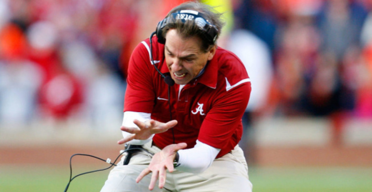 Alabama Crimson Tide head coach Nick Saban appears frustrated with his team on the sideline during a college football game in the SEC.