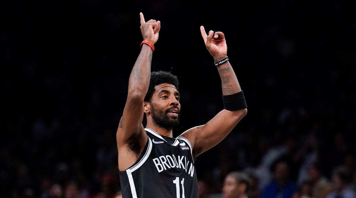 Brooklyn Nets’ Kyrie Irving reacts after sinking a basket during the second half of the opening basketball game of the NBA play-in tournament against the Cleveland Cavaliers, Tuesday, April 12, 2022, in New York.
